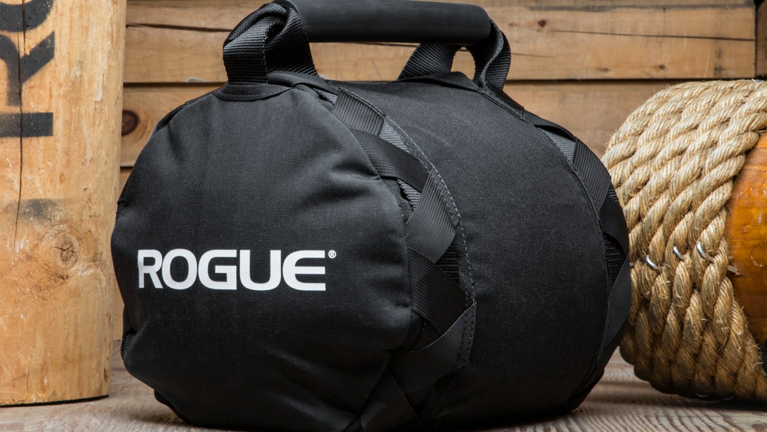 Rogue strongman deals sandbag workout